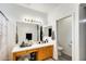 This full bathroom features a shower-tub combination and wooden vanity with a white countertop at 14752 W Evans Dr, Surprise, AZ 85379