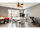 Casual dining area with wood-look floors, ceiling fan, and natural light at 14752 W Evans Dr, Surprise, AZ 85379