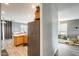 Bright kitchen with a stainless steel refrigerator and a charming cat perched above the cabinets at 14752 W Evans Dr, Surprise, AZ 85379