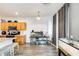 Open living space with a reptile tank, seamlessly connecting the kitchen and dining areas for entertaining at 14752 W Evans Dr, Surprise, AZ 85379