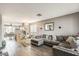 Open-concept living room featuring gray sofa and neutral decor at 14752 W Evans Dr, Surprise, AZ 85379