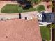 Overhead aerial shot revealing the roof, patio, and beautifully landscaped backyard with artificial turf at 15011 S 27Th Pl, Phoenix, AZ 85048