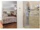 Walk-in shower featuring glass doors and tile surround, adjacent to the main bedroom at 15011 S 27Th Pl, Phoenix, AZ 85048