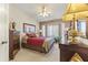 Comfortable bedroom featuring a ceiling fan, neutral decor and a large bay window at 15011 S 27Th Pl, Phoenix, AZ 85048