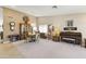 Formal dining room featuring elegant furnishings, carpet flooring, and a large chandelier with ample space at 15011 S 27Th Pl, Phoenix, AZ 85048