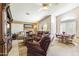 Spacious living room with lots of natural light, stylish seating, and an adjacent dining area at 15011 S 27Th Pl, Phoenix, AZ 85048