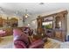 Open-concept space including the kitchen and living room with comfortable leather seating at 15011 S 27Th Pl, Phoenix, AZ 85048