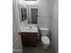 Half bathroom with vanity and toilet at 15446 W Jenan Dr, Surprise, AZ 85379