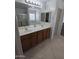 Bathroom with double vanity and separate shower at 15446 W Jenan Dr, Surprise, AZ 85379