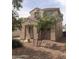 Two-story home with desert landscaping and a front porch at 15446 W Jenan Dr, Surprise, AZ 85379