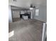 Open-concept living room with carpet and kitchen island in view at 15446 W Jenan Dr, Surprise, AZ 85379
