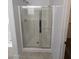 Modern bathroom shower with glass doors and chrome fixtures at 15446 W Jenan Dr, Surprise, AZ 85379