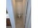A powder room with tile flooring and a white toilet at 15446 W Jenan Dr, Surprise, AZ 85379