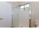 Bathroom with a tiled walk-in shower and glass door at 15806 N 107Th Pl, Scottsdale, AZ 85255