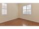 Bright and airy bedroom with hardwood floors and shuttered windows at 15806 N 107Th Pl, Scottsdale, AZ 85255