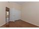 Comfortable bedroom with hardwood floors and closet with sliding doors at 15806 N 107Th Pl, Scottsdale, AZ 85255