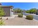 Desert-style landscaping complements this lovely home with a convenient two-car garage at 15806 N 107Th Pl, Scottsdale, AZ 85255