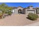 Single story home showcasing a neutral color palette, tile roof and desert landscaping at 15806 N 107Th Pl, Scottsdale, AZ 85255