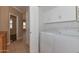 Convenient laundry room with white cabinets and included washer/dryer at 15806 N 107Th Pl, Scottsdale, AZ 85255