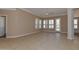Spacious living room with tile floors, neutral walls, and plantation shutters at 15806 N 107Th Pl, Scottsdale, AZ 85255
