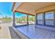 Relaxing covered patio with tiled flooring and desert landscaping view at 15806 N 107Th Pl, Scottsdale, AZ 85255