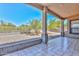 Enjoy this spacious covered patio with tiled flooring, perfect for outdoor entertaining at 15806 N 107Th Pl, Scottsdale, AZ 85255