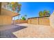 Spacious backyard with brick pavers, covered patio and secure block fence at 1726 W Claremont St, Phoenix, AZ 85015