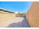 Spacious backyard with brick pavers and block fence at 1726 W Claremont St, Phoenix, AZ 85015
