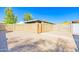 Private backyard with paver patio, block fencing, and alley access gate at 1726 W Claremont St, Phoenix, AZ 85015