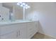 Bathroom featuring a dual sink vanity with white cabinets and modern fixtures at 1726 W Claremont St, Phoenix, AZ 85015