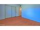 Bedroom with wood-look floors, large closet, and neutral paint at 1726 W Claremont St, Phoenix, AZ 85015