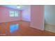 Spacious bedroom with a ceiling fan and a window bringing in lots of natural light at 1726 W Claremont St, Phoenix, AZ 85015