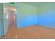 Bedroom with wood-look flooring and lots of natural light from a large window at 1726 W Claremont St, Phoenix, AZ 85015