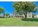 Beautifully maintained community green space surrounded by lush landscaping and homes at 1726 W Claremont St, Phoenix, AZ 85015