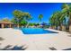 Sparkling community pool with ample seating and shade structures at 1726 W Claremont St, Phoenix, AZ 85015