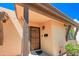 Covered front porch with decorative security door and dark wood accents at 1726 W Claremont St, Phoenix, AZ 85015