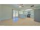 Bright kitchen with white cabinets, stainless steel appliances, and a breakfast bar that opens to a patio at 1726 W Claremont St, Phoenix, AZ 85015