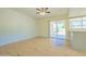 Open living area with laminate wood flooring and sliding glass doors to patio at 1726 W Claremont St, Phoenix, AZ 85015