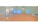Spacious living area with laminate floors, leading to a patio and kitchen at 1726 W Claremont St, Phoenix, AZ 85015