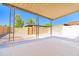 Spacious covered patio with brick pavers and secure block fence offers great outdoor living at 1726 W Claremont St, Phoenix, AZ 85015