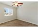 This well-lit bedroom offers a view of the neighborhood through a window at 1741 S Clearview Ave # 74, Mesa, AZ 85209