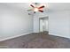 This spacious bedroom features plush carpeting and a modern ceiling fan for ultimate comfort at 1741 S Clearview Ave # 74, Mesa, AZ 85209