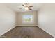 A bright and airy bedroom with neutral carpet and a large window, creating a serene atmosphere at 1741 S Clearview Ave # 74, Mesa, AZ 85209
