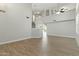 Spacious living room with wood-style tile flooring, a high ceiling and lots of natural light at 1741 S Clearview Ave # 74, Mesa, AZ 85209
