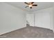 Bedroom featuring a closet for ample storage, carpeted floors, and a ceiling fan at 1811 S 39Th St # 30, Mesa, AZ 85206