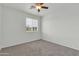 This is a bedroom with a window with blinds and neutral carpet and paint at 1811 S 39Th St # 30, Mesa, AZ 85206