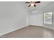 Bright bedroom with vaulted ceilings, fan, and an air conditioner unit, offering comfort and functionality at 1811 S 39Th St # 30, Mesa, AZ 85206