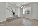 Open-concept dining room featuring stylish chandelier, large windows and neutral paint at 1811 S 39Th St # 30, Mesa, AZ 85206