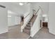 Bright and airy foyer featuring a staircase, tile flooring, and access to other living spaces at 1811 S 39Th St # 30, Mesa, AZ 85206