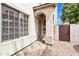 Welcoming front entrance featuring an arched entryway, security door, and stylish window details at 1811 S 39Th St # 30, Mesa, AZ 85206